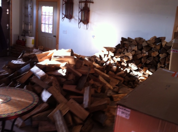 A firewood delivery, awaiting stacking. [Photo by me, 2015.]
